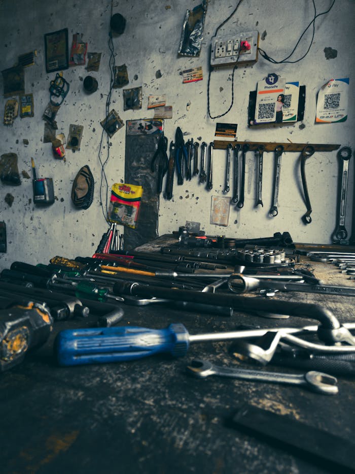A detailed view of an organized workshop filled with various hand tools on a workbench.